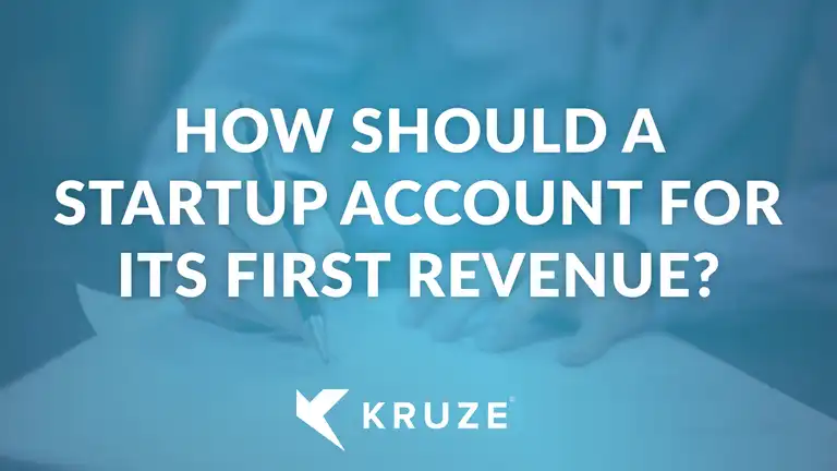 How should a startup account for its first revenue?